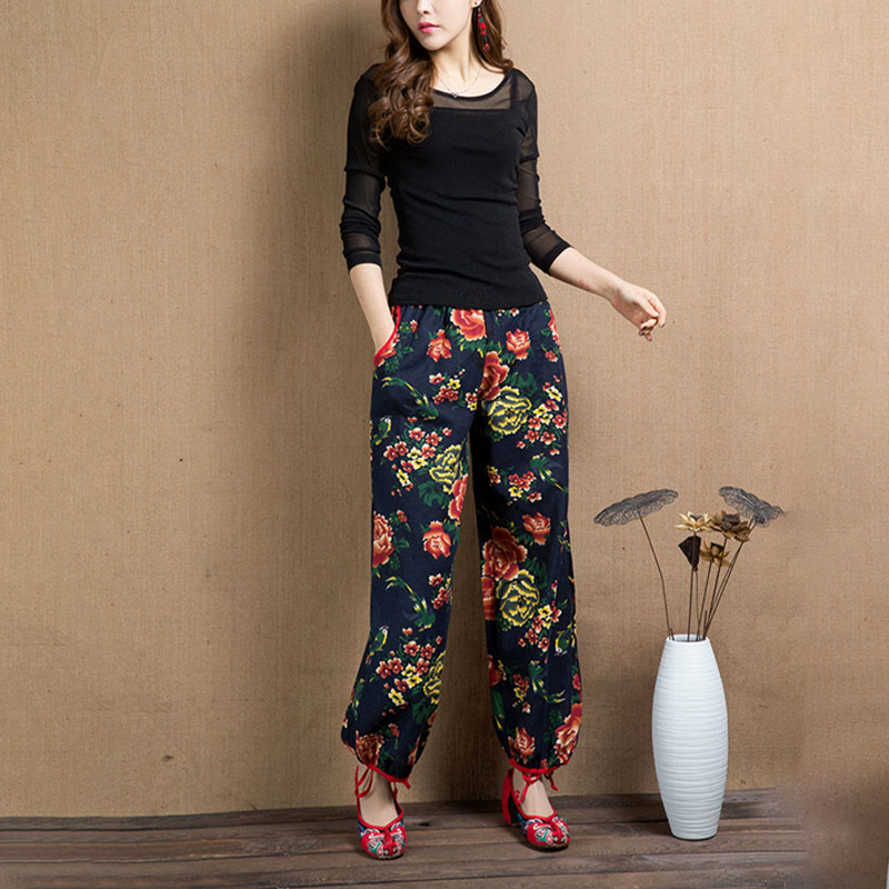 Pantalones bombachos con estampado de flores rojas y verdes de estilo étnico con Buddha Stones y bolsillos