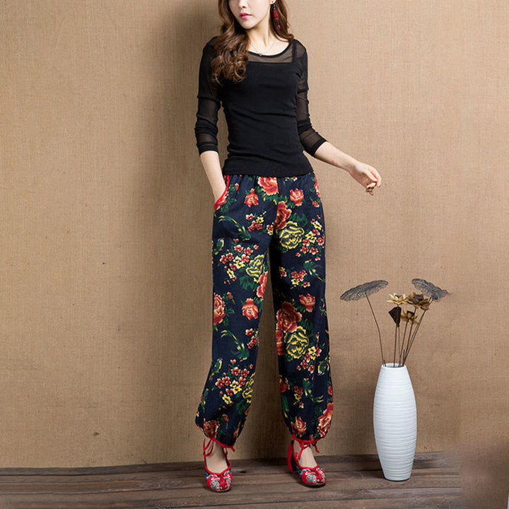 Pantalones bombachos con estampado de flores rojas y verdes de estilo étnico con Buddha Stones y bolsillos