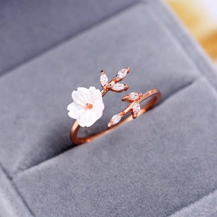 Anillo de la suerte de cobre con diseño de hojas de flor de ciruelo y Buddha Stones