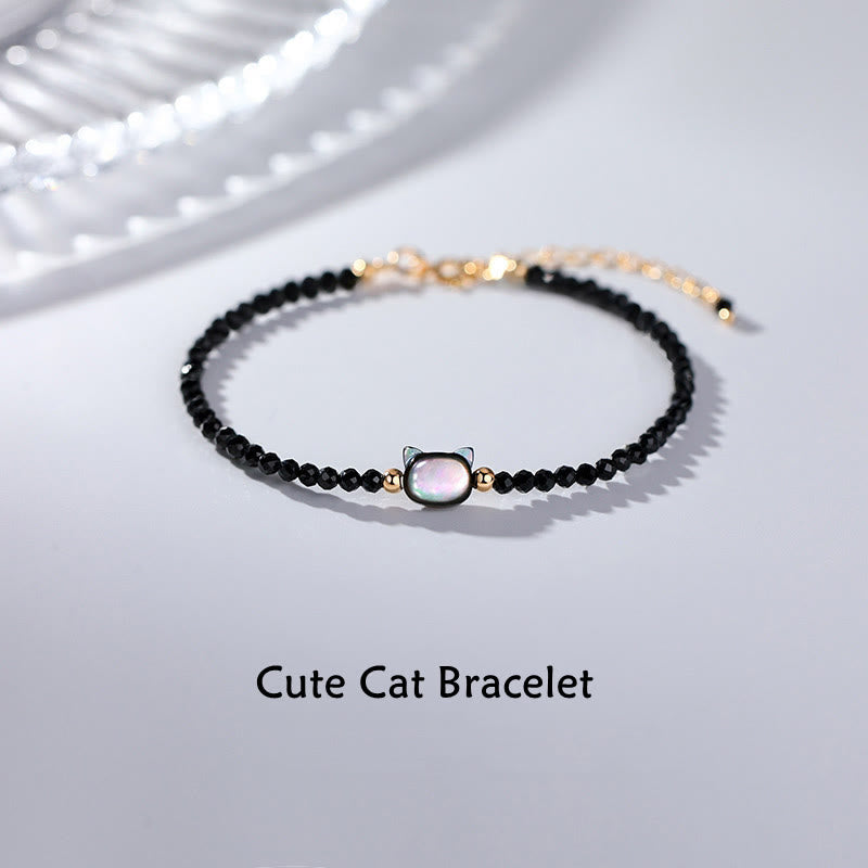 Pulsera curativa de piedra Tridacna de gato lindo de cristal blanco de espinela negra chapada en oro de 14 quilates con Buddha Stones - Espinela negra y piedra Tridacna - image 1