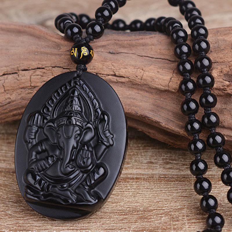 Collar con amuleto de riqueza de elefante Ganesh Ganpati de obsidiana tibetana con Buddha Stones