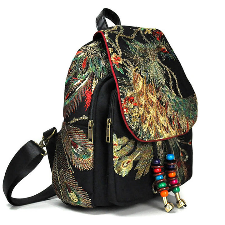Mochila con borlas de lona con bordado de pavo real