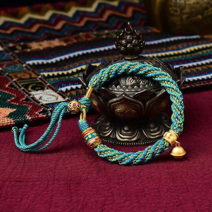 Pulsera de cuerda trenzada con dije de campana y rueda de oración Thangka de protección de la suerte hecha a mano tibetana