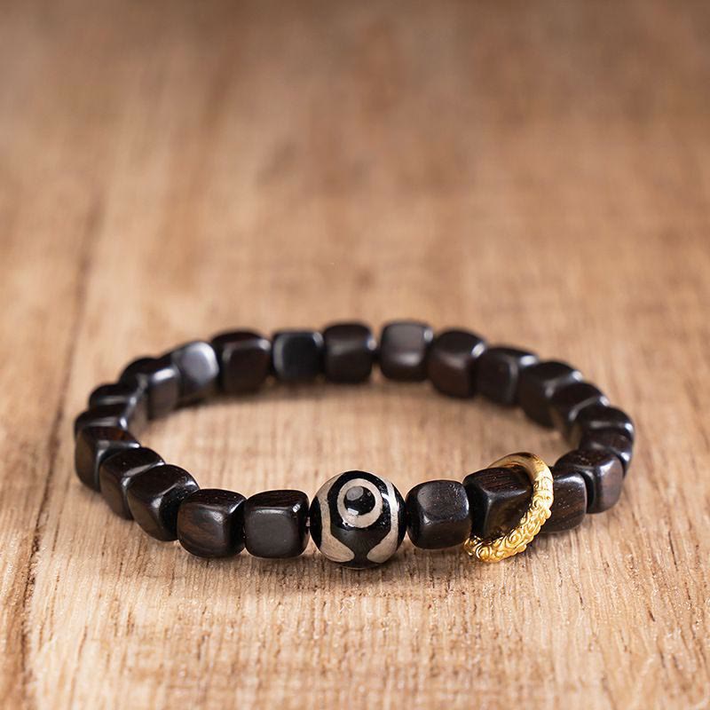Pulsera de equilibrio de cuentas Dzi de madera de ébano tibetano con Buddha Stones