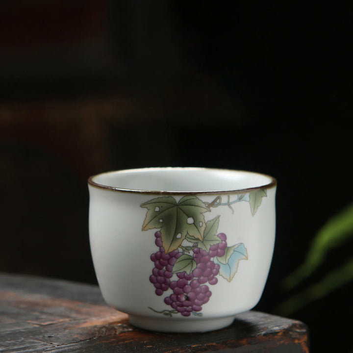 Taza de té de cerámica con Buddha Stones , níspero, lichi, paisaje nevado, uva, manzana, taza de té de Kung Fu