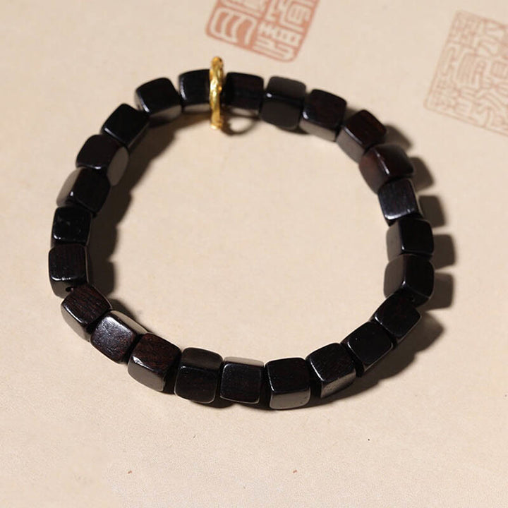 Pulsera de paz y calma con cuentas cuadradas de madera de ébano tibetano con Buddha Stones