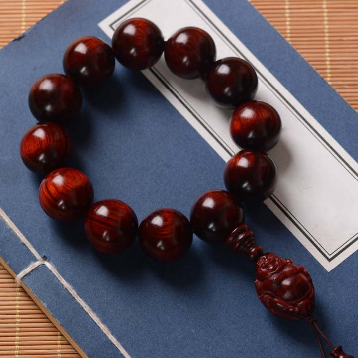 Pulsera de protección del dios de la riqueza de Buda sonriente de sándalo rojo de hoja pequeña con piedras de Buddha Stones