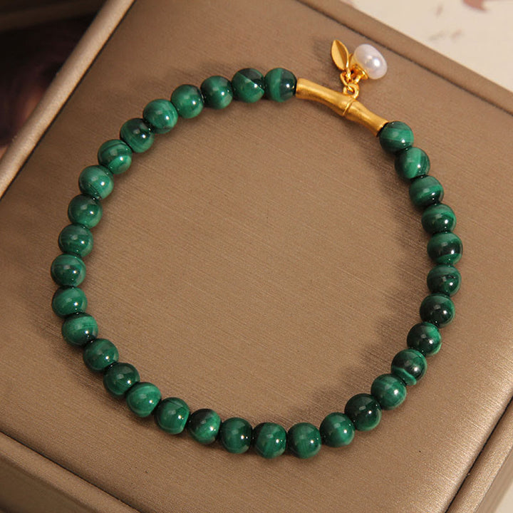 Pulsera antiansiedad de bambú de la suerte con perlas de malaquita natural de Buddha Stones - image 1