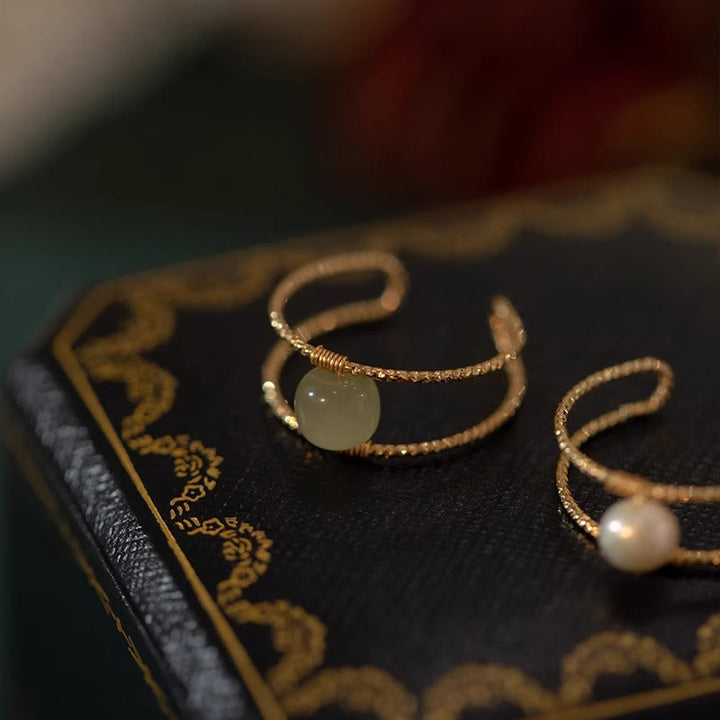 Anillo ajustable de la suerte de cobre de doble capa con cuentas de perlas de Jade redondas de Buddha Stones