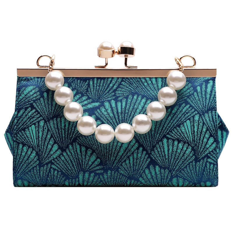 Bolso de mano de metal perlado con diseño de hoja azul pavo real vintage de Buddha Stones