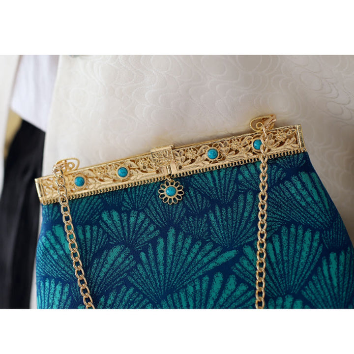 Bolso bandolera con cadena de metal con líneas azules y Buddha Stones