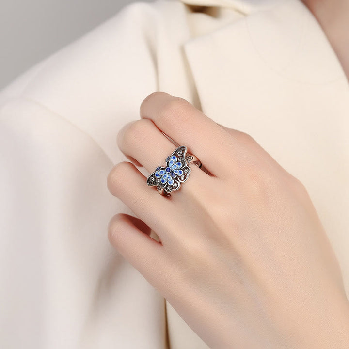 Anillo de amor con patrón de mariposa azul esmaltado hueco con Buddha Stones