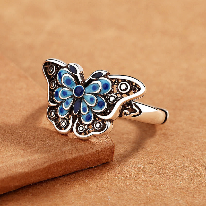 Anillo de amor con patrón de mariposa azul esmaltado hueco con Buddha Stones