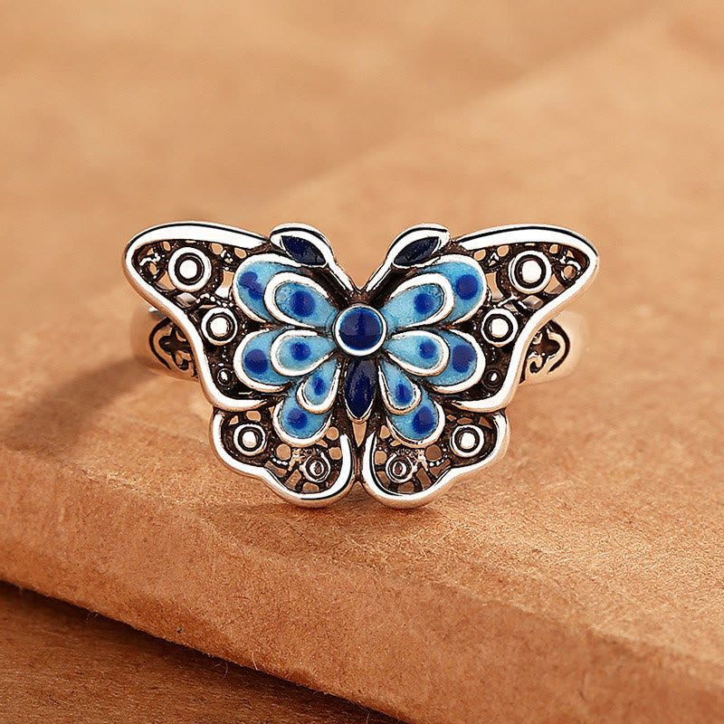 Anillo de amor con patrón de mariposa azul esmaltado hueco con Buddha Stones