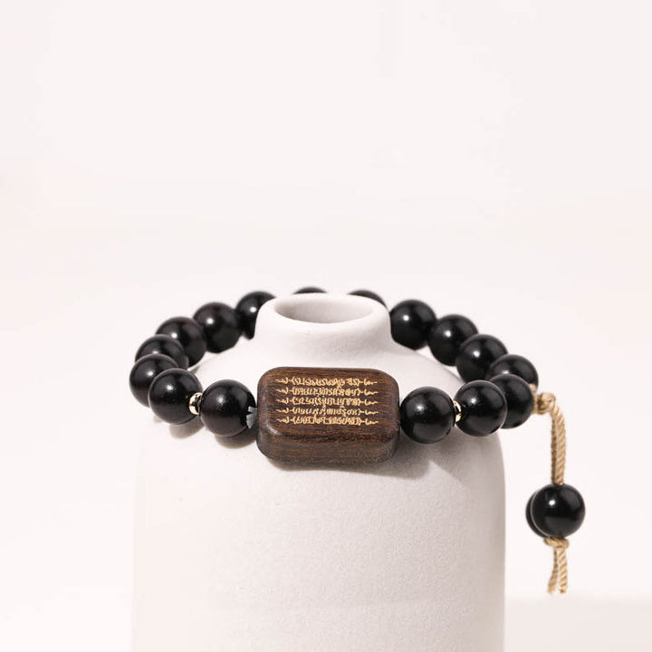 Pulsera de Paz Grabada con Escrituras en Madera de Ébano de Piedras de Buda