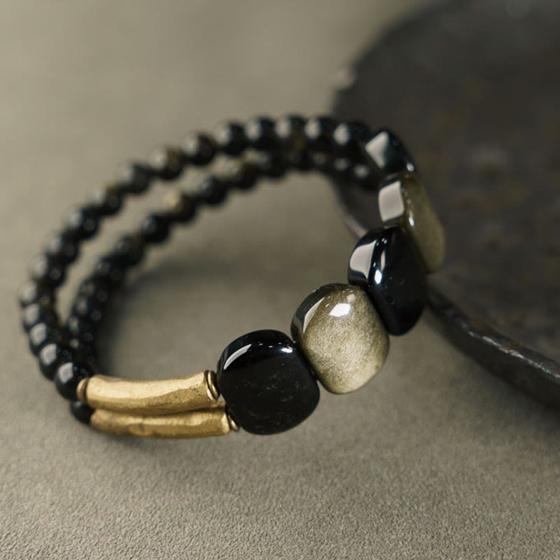 Buddha Stones Pulsera reforzada de obsidiana negra con brillo dorado - image 1