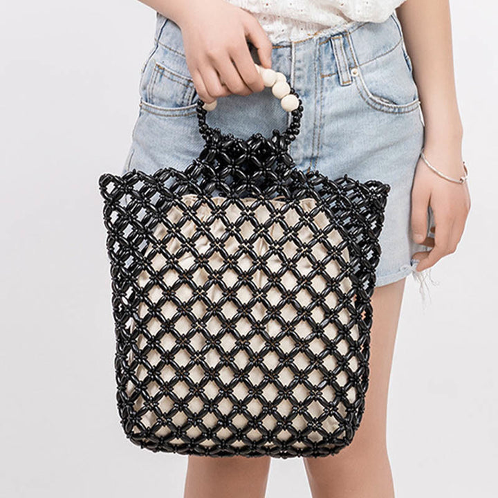 Bolso de cuentas de madera huecas tejidas a mano con hilo de pesca tejida y piedras de Buda