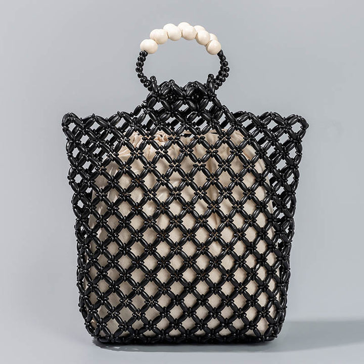 Bolso de cuentas de madera huecas tejidas a mano con hilo de pesca tejida y piedras de Buda