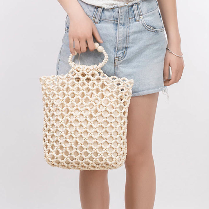 Bolso de cuentas de madera huecas tejidas a mano con hilo de pesca tejida y piedras de Buda