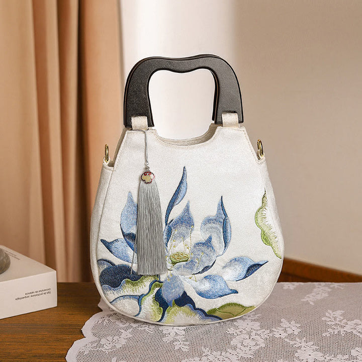 Bolso de mano bordado con piedras de Buda y loto