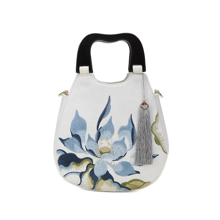 Bolso de mano bordado con piedras de Buda y loto