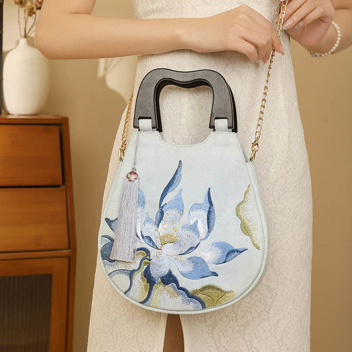 Bolso de mano bordado con piedras de Buda y loto