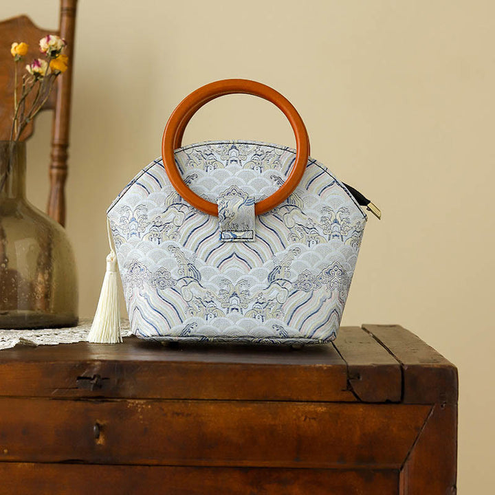 Bolso de mano con estampado de piedras de Buda, nubes auspiciosas y conchas