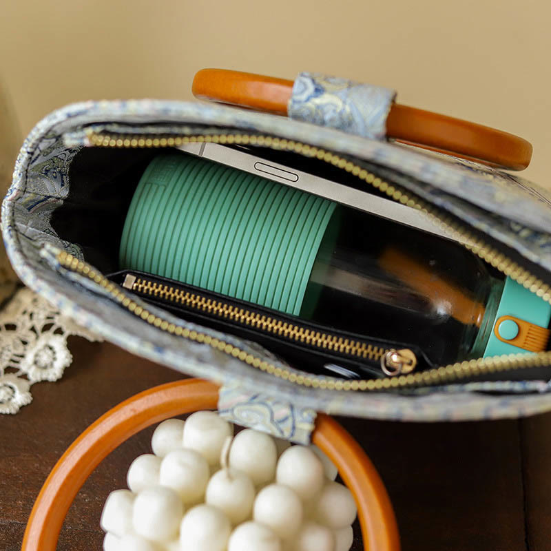Bolso de mano con estampado de piedras de Buda, nubes auspiciosas y conchas