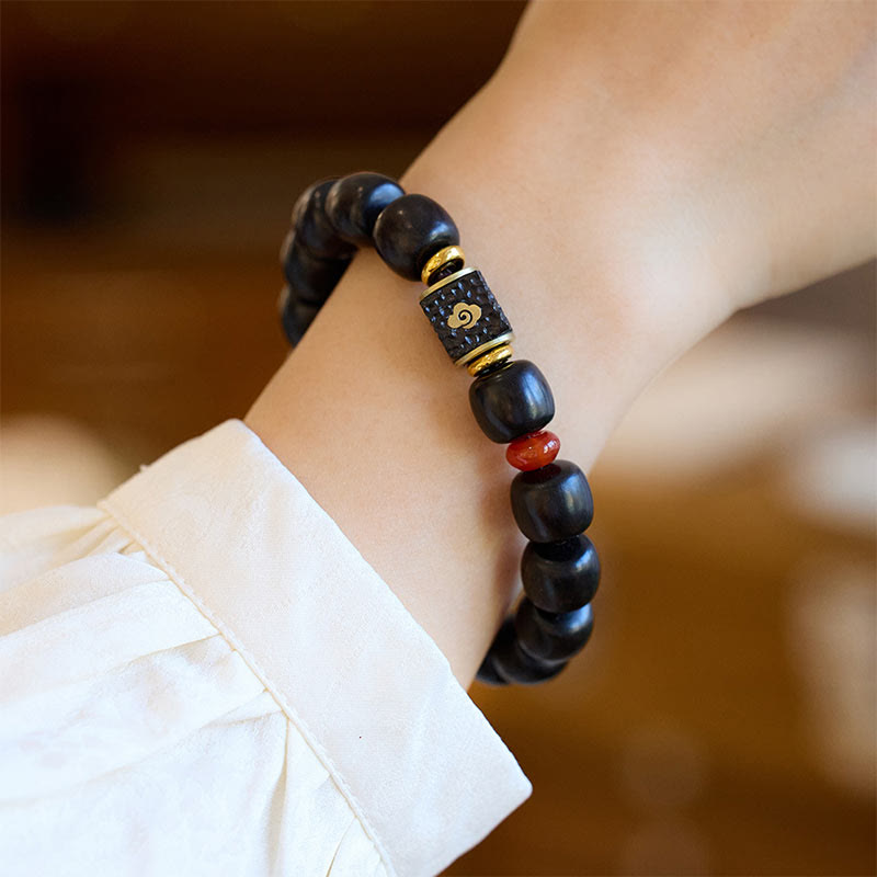 Pulsera de calma grabada en madera de ébano con nubes auspiciosas y Buddha Stones
