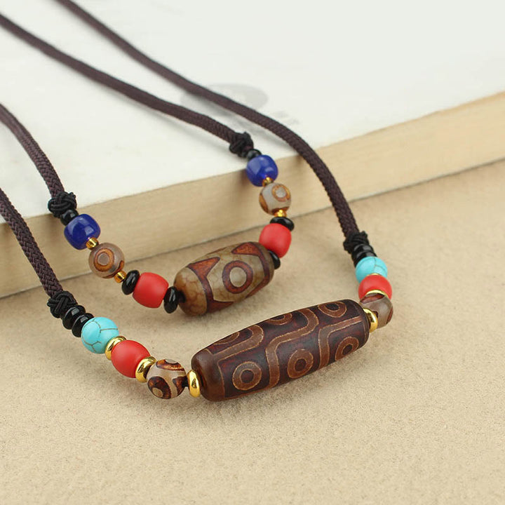 Buddha Stones Joyas Tibetanas de Ojo de Nueve Dzi Cuentas Dzi de Tres Ojos Collar de Protección Colgante