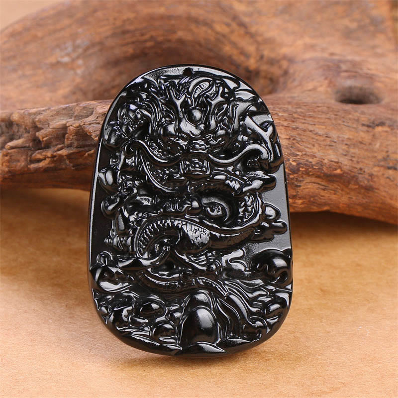 Colgante de protección con dragón tallado en obsidiana negra Buddha Stones - image 2