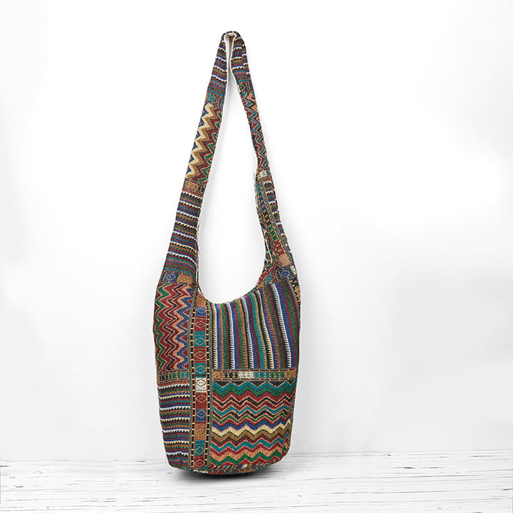 Bolso bandolera de algodón con patrón de olas verdes y marrones de Buddha Stones