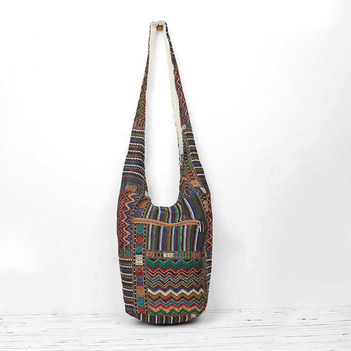Bolso bandolera de algodón con patrón de olas verdes y marrones de Buddha Stones