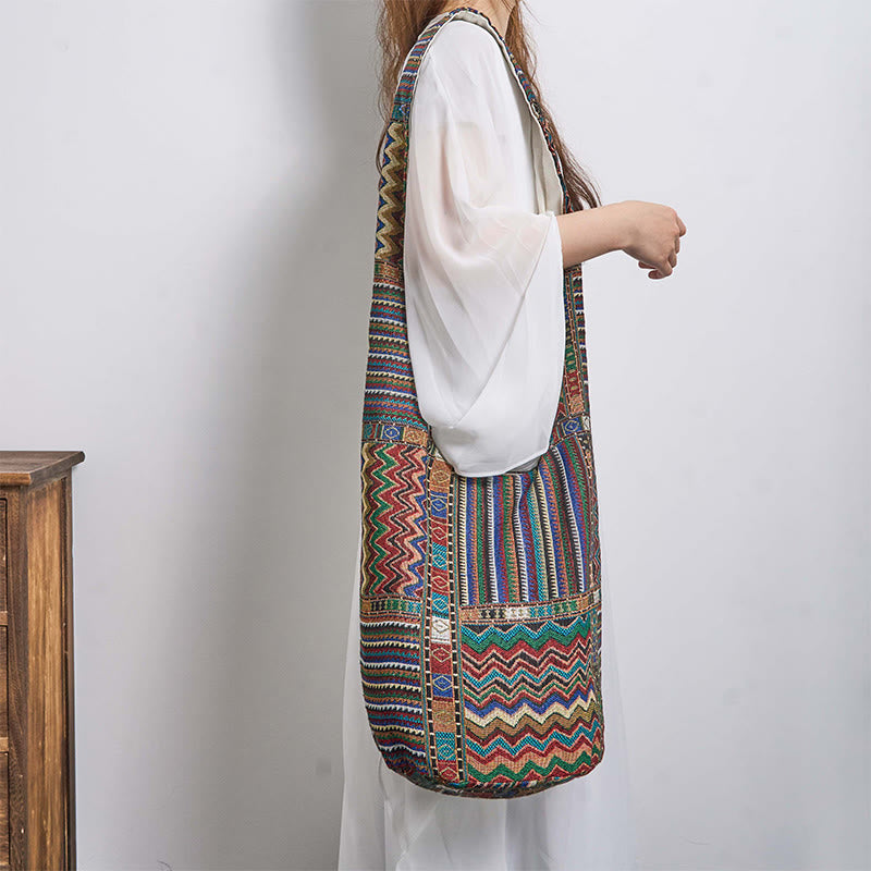 Bolso bandolera de algodón con patrón de olas verdes y marrones de Buddha Stones