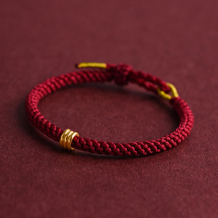 Pulsera de cuerda trenzada con diseño de triple anillo en oro 999 con Buddha Stones