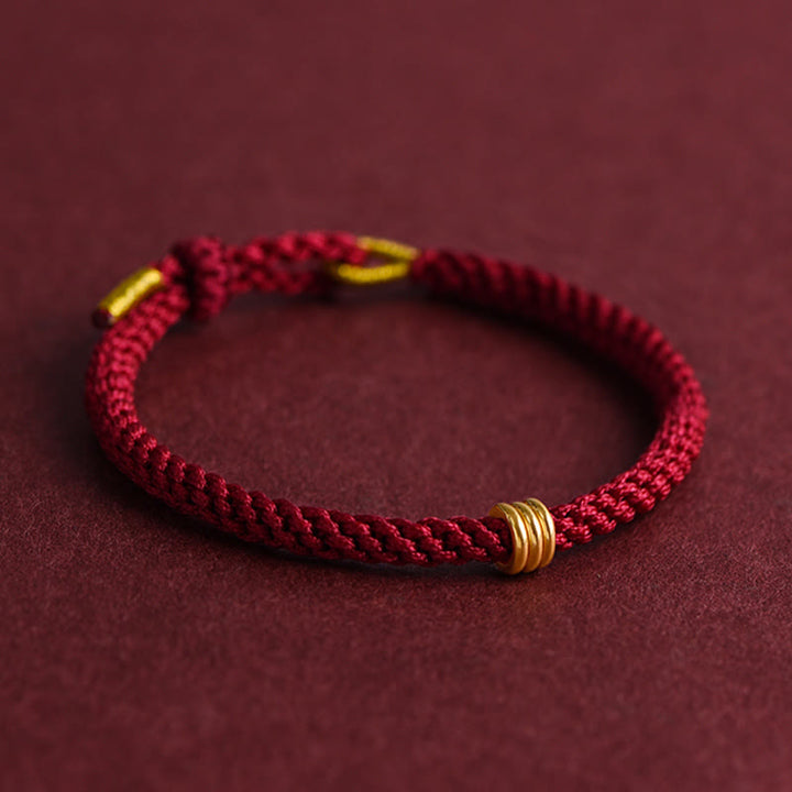 Pulsera de cuerda trenzada con diseño de triple anillo en oro 999 con Buddha Stones