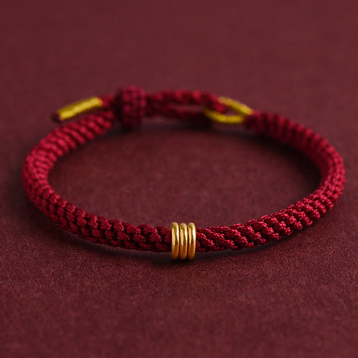 Pulsera de cuerda trenzada con diseño de triple anillo en oro 999 con Buddha Stones