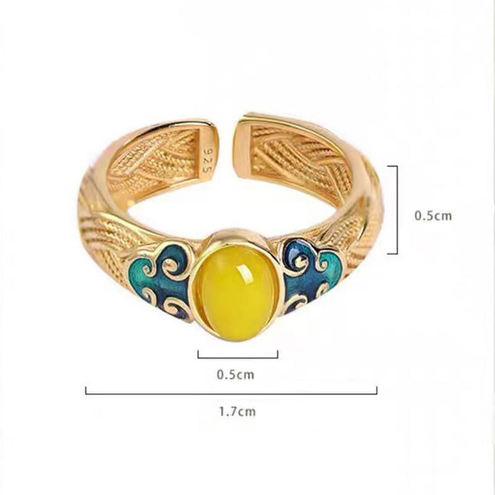 Anillo ajustable con nubes auspiciosas de cobre y ámbar con Buddha Stones