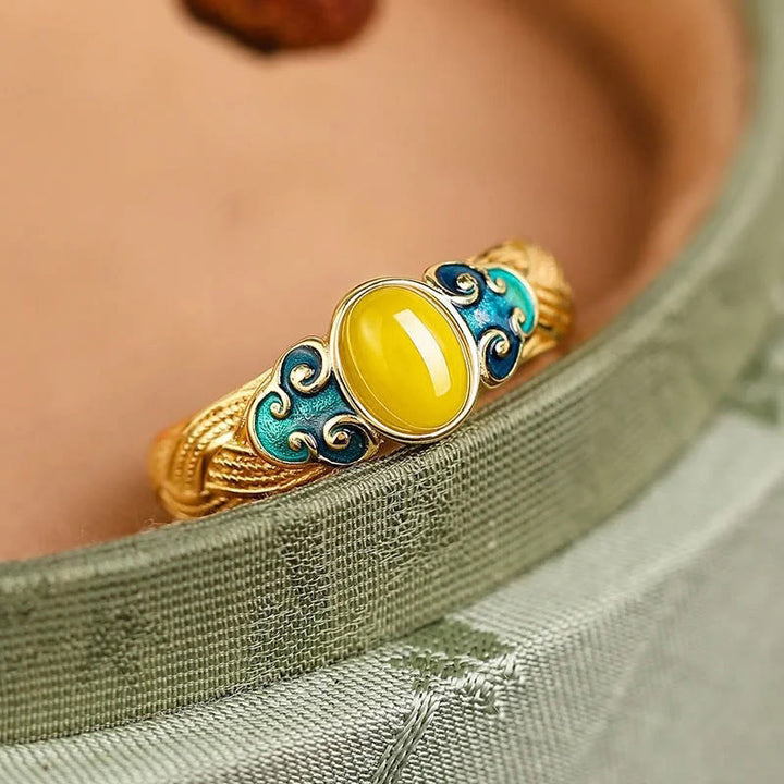 Anillo ajustable con nubes auspiciosas de cobre y ámbar con Buddha Stones