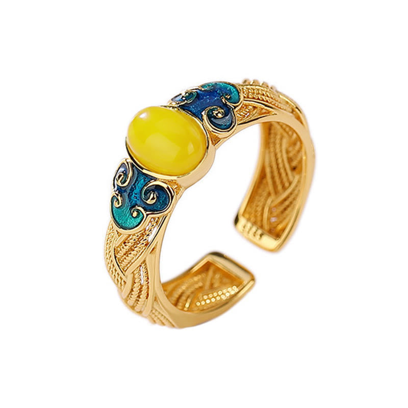 Anillo ajustable con nubes auspiciosas de cobre y ámbar con Buddha Stones