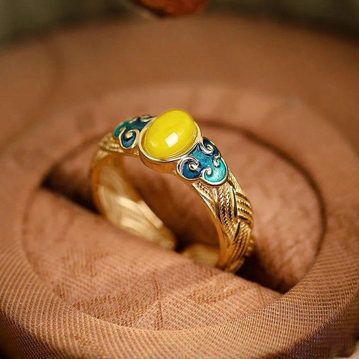 Anillo ajustable con nubes auspiciosas de cobre y ámbar con Buddha Stones