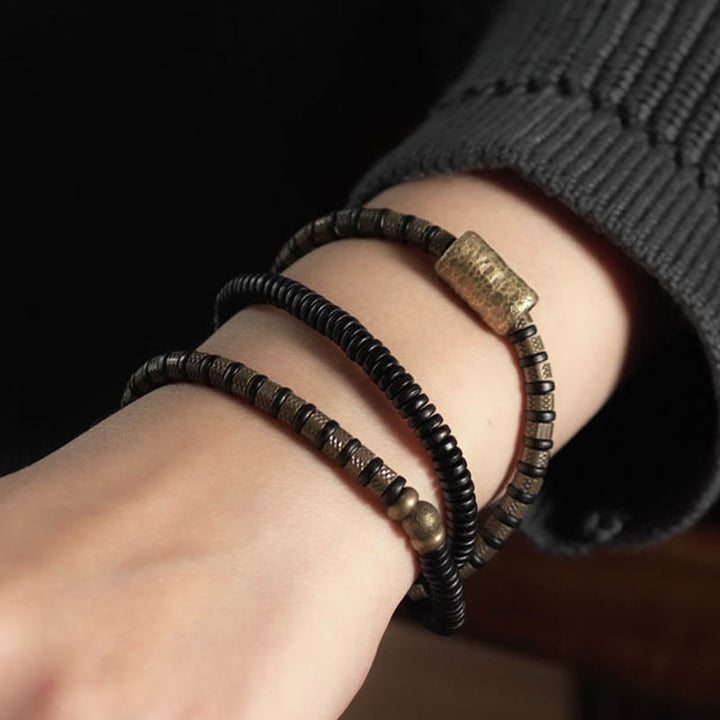 Pulsera de cobre multicapa con cuentas de madera de ébano tibetano y Buddha Stones