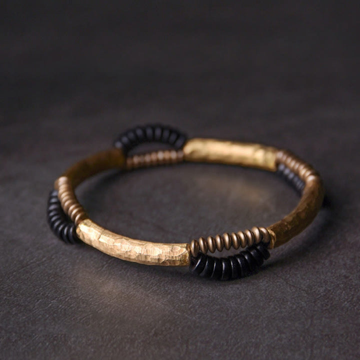 Pulsera hecha a mano con Buddha Stones, madera de ébano vintage, cobre, suerte y riqueza