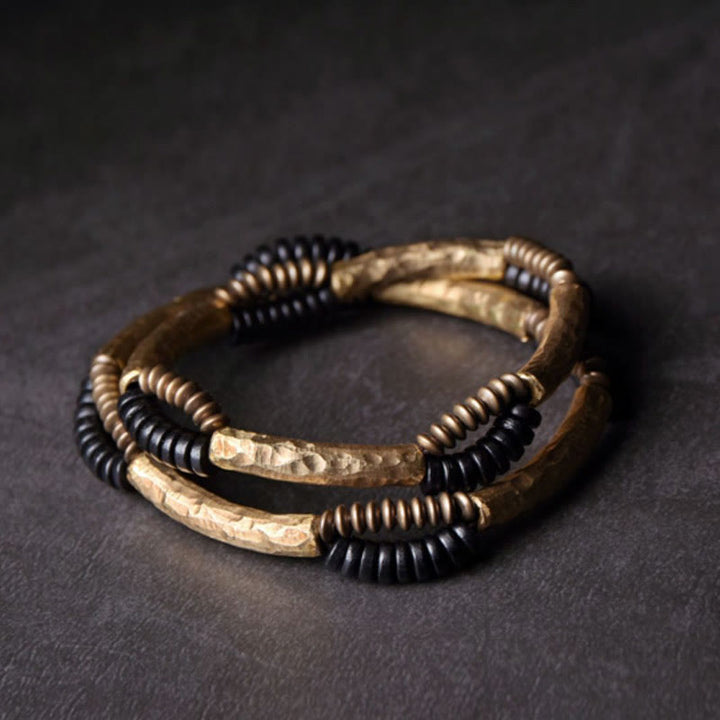 Pulsera hecha a mano con Buddha Stones, madera de ébano vintage, cobre, suerte y riqueza