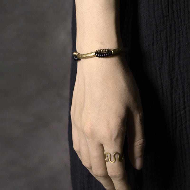 Pulsera hecha a mano con Buddha Stones, madera de ébano vintage, cobre, suerte y riqueza