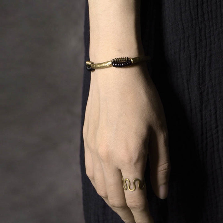 Pulsera hecha a mano con Buddha Stones, madera de ébano vintage, cobre, suerte y riqueza