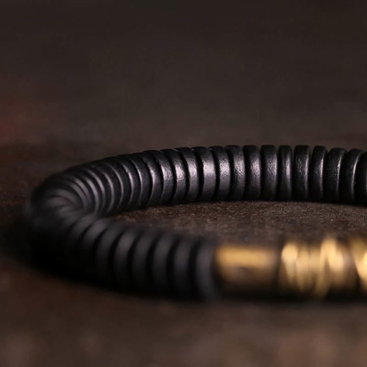 Pulsera de cobre y madera de ébano tibetano con Buddha Stones