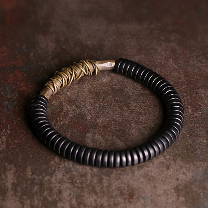 Pulsera de cobre y madera de ébano tibetano con Buddha Stones