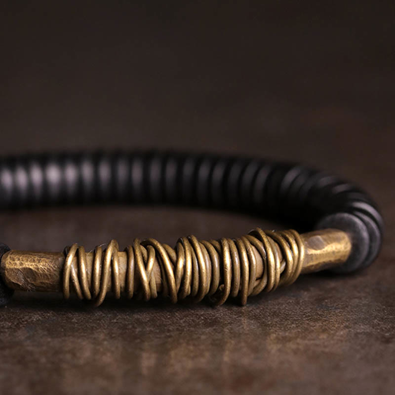 Pulsera de cobre y madera de ébano tibetano con Buddha Stones