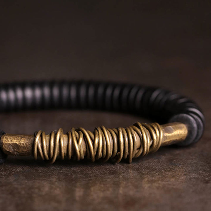 Pulsera de cobre y madera de ébano tibetano con Buddha Stones